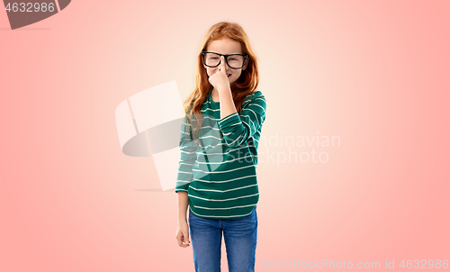 Image of smiling red haired student girl in glasses