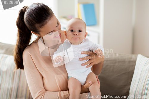 Image of happy mother with little baby boy at home