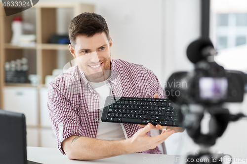 Image of male video blogger with keyboard videoblogging