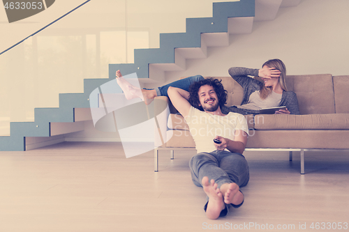 Image of young couple relaxes in the living room