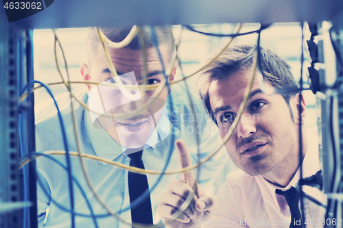 Image of it engineers in network server room