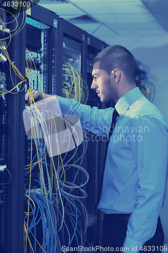 Image of young it engineer in datacenter server room