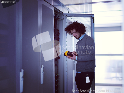 Image of technician using digital cable analyzer