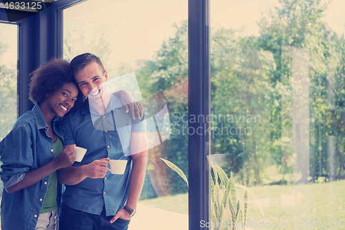 Image of romantic happy young couple relax at modern home indoors