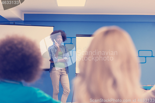 Image of Black woman Speaker Seminar Corporate Business Meeting Concept