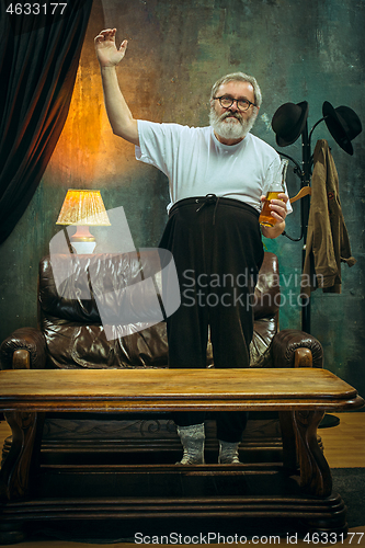 Image of The crazy football fan watching soccer game on television