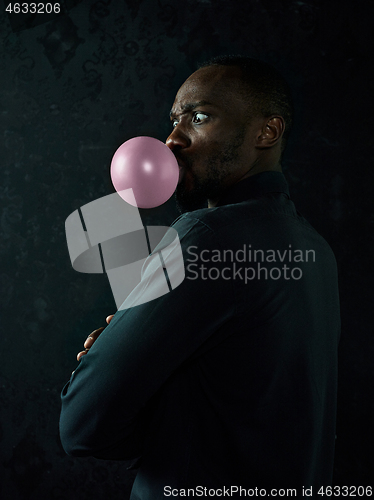 Image of The african american man with bubble gum