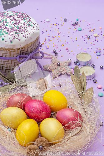 Image of vertical photo of Easter attributes in yellow-pink tones