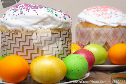 Image of compilation of Easter cakes and painted multi-colored eggs