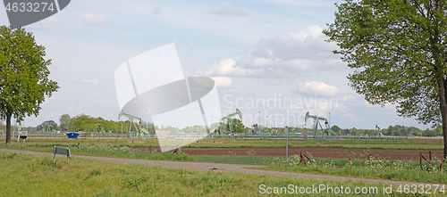 Image of Landscape with oil pump jack