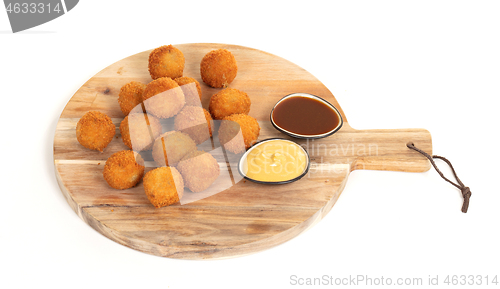 Image of Dutch traditional snack bitterbal on a serving board