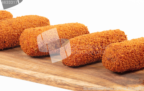 Image of Brown crusty dutch kroketten on a serving tray, selective focus