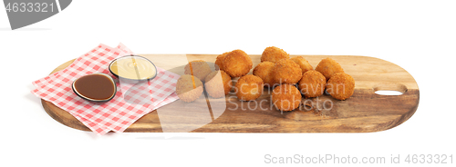 Image of Dutch traditional snack bitterbal on a serving board