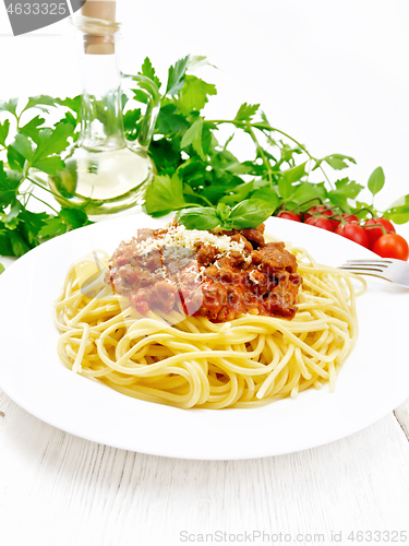 Image of Spaghetti with bolognese on wooden board