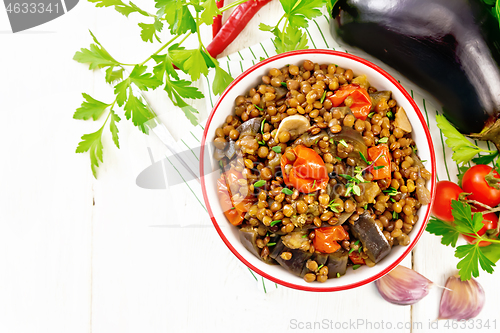 Image of Lentils with eggplant in bowl on board top