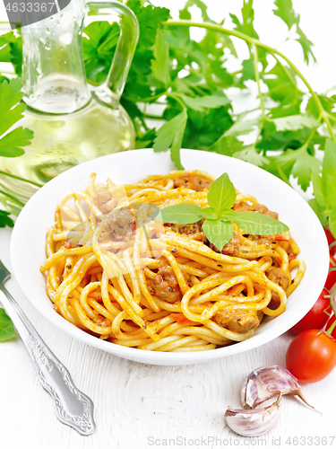 Image of Spaghetti with bolognese in plate on light board