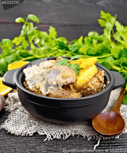 Image of Liver with oranges in pan on burlap