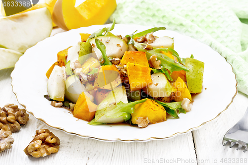 Image of Salad of pumpkin and pear in plate on board
