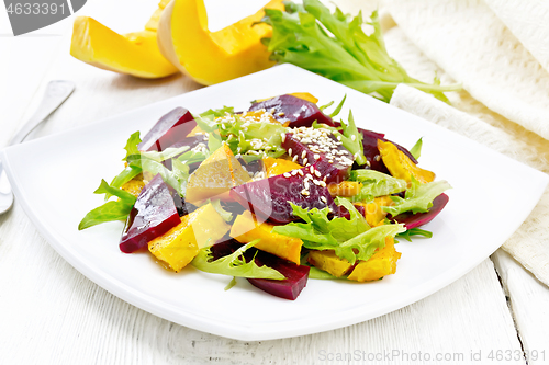 Image of Salad of pumpkin and beetroot in plate on light board