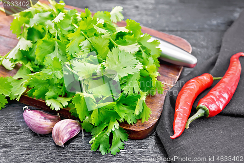 Image of Cilantro fresh with garlic on board