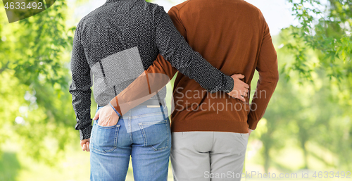 Image of close up of hugging male gay couple