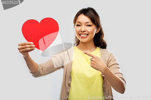 Image of happy asian woman with red heart