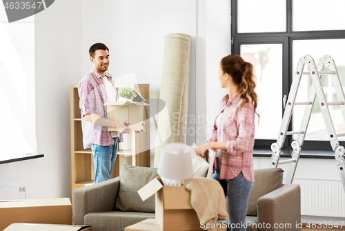 Image of happy couple with stuff moving to new home