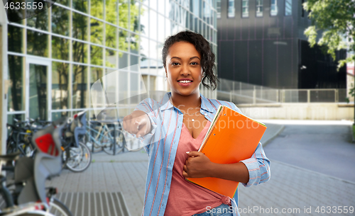 Image of african american student woman with notebooks