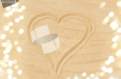 Image of picture of heart in sand on summer beach