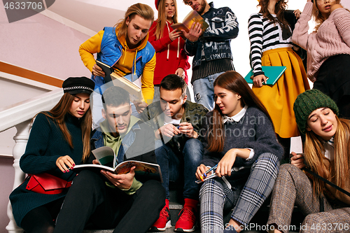 Image of The group of cheerful happy students sitting in a lecture hall before lesson