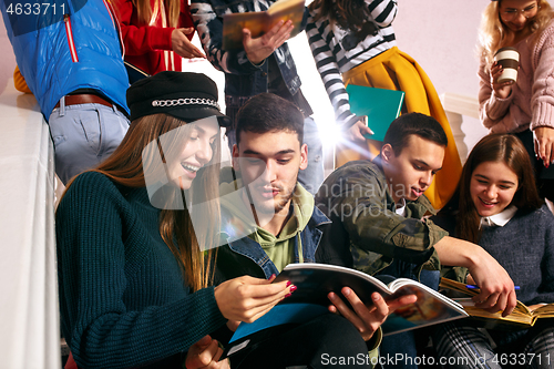 Image of The group of cheerful happy students sitting in a lecture hall before lesson