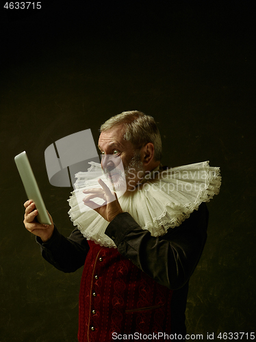 Image of Official portrait of historical governor from the golden age. Studio shot against dark wall.