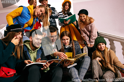 Image of The group of cheerful happy students sitting in a lecture hall before lesson