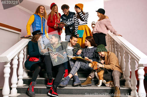 Image of The group of cheerful happy students sitting in a lecture hall before lesson