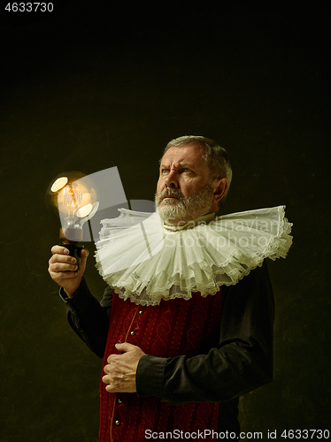 Image of Official portrait of historical governor from the golden age. Studio shot against dark wall.