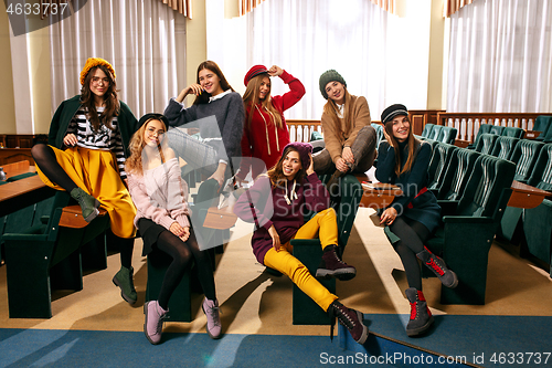 Image of The group of cheerful happy students sitting in a lecture hall before lesson