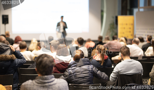 Image of Business speaker giving a talk at business conference event.