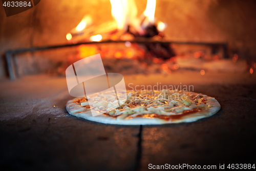 Image of rustic pizza in wood fired oven