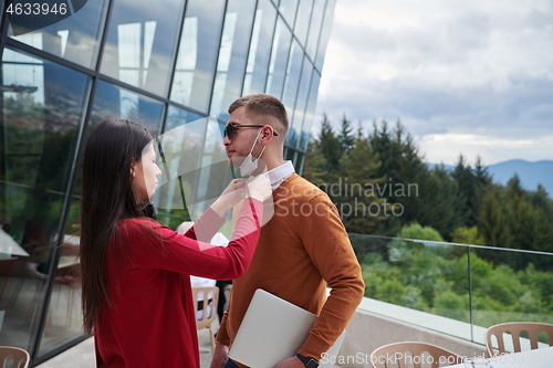 Image of business people wearing protective mask