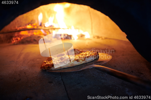 Image of rustic pizza in wood fired oven