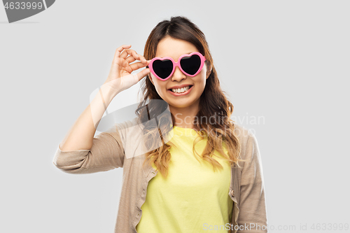 Image of asian woman in heart-shaped sunglasses