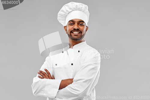 Image of happy male indian chef in toque