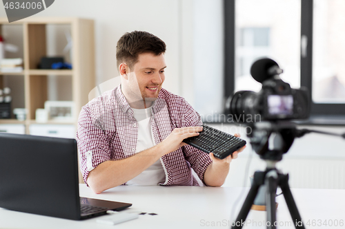 Image of male video blogger with keyboard videoblogging