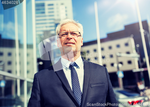 Image of senior businessman on city street