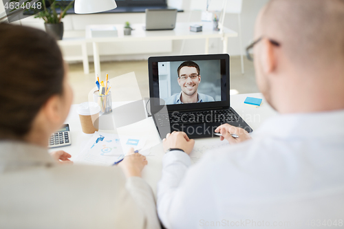 Image of business team having video conference at office