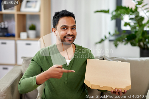 Image of indian man with box of takeaway pizza at home