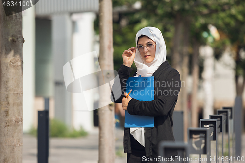 Image of Beautiful muslim successful businesswoman portrait, confident happy CEO