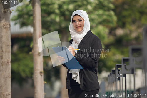 Image of Beautiful muslim successful businesswoman portrait, confident happy CEO