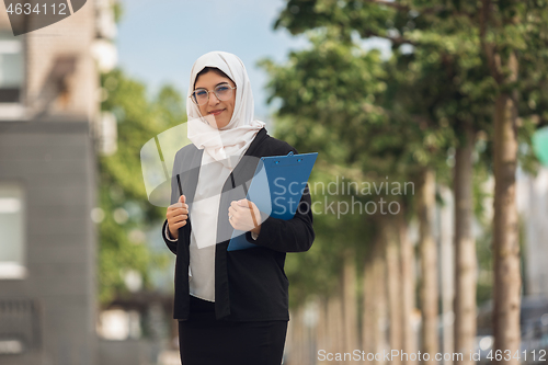 Image of Beautiful muslim successful businesswoman portrait, confident happy CEO