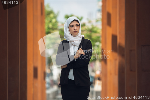 Image of Beautiful muslim successful businesswoman portrait, confident happy CEO